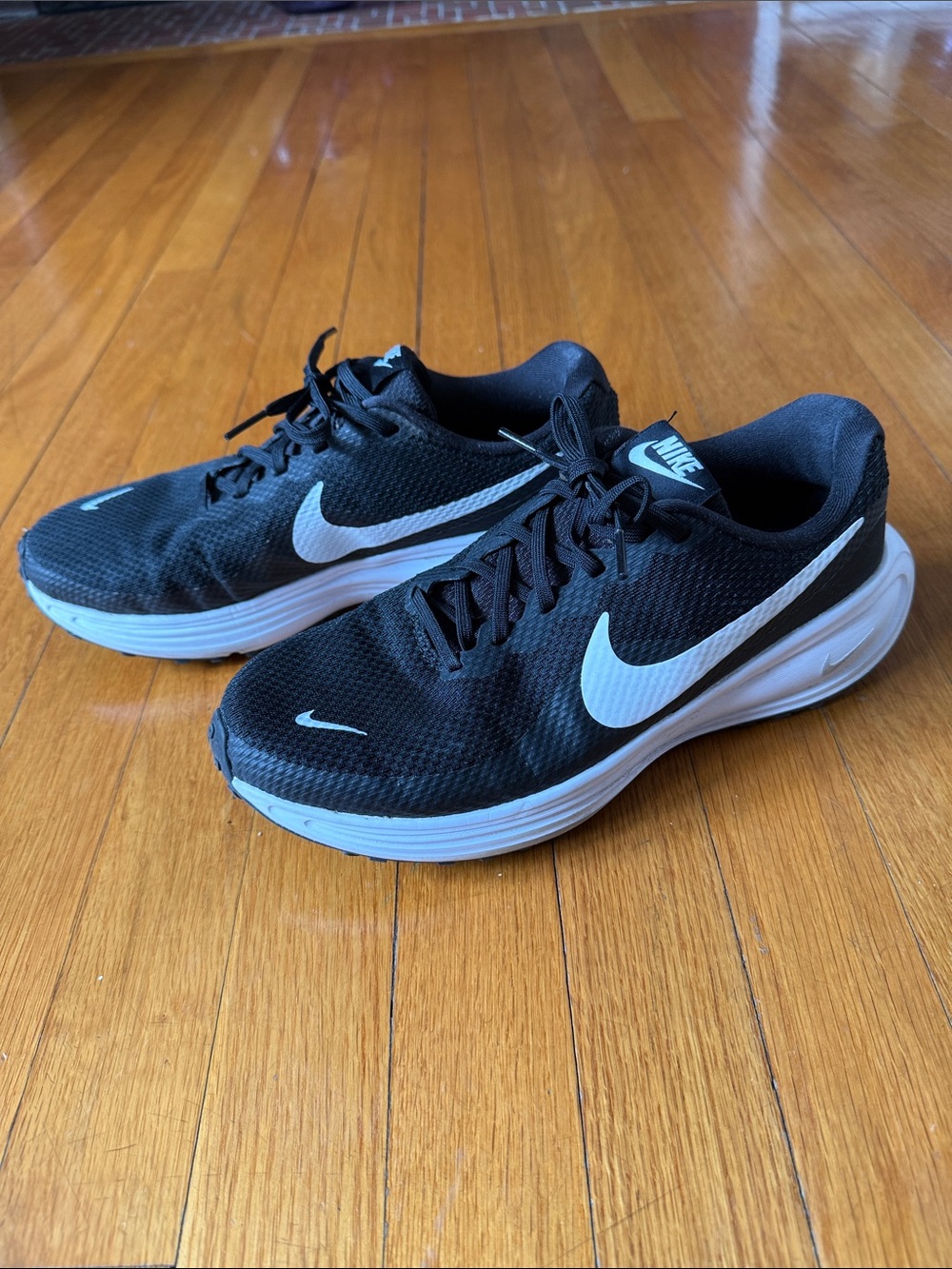 Nike Women’s Black Athletic Sneakers with White Swoosh